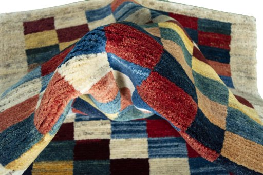 Corner detail of New Persian Gabbeh rug showing border pattern and Wool pile