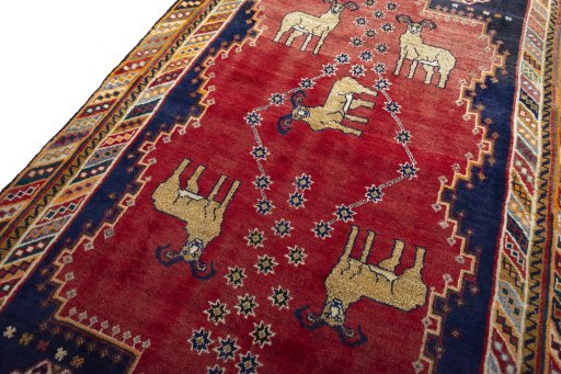 Backside of handmade 2000s Persian Gabbeh rug showing knot structure and weave density