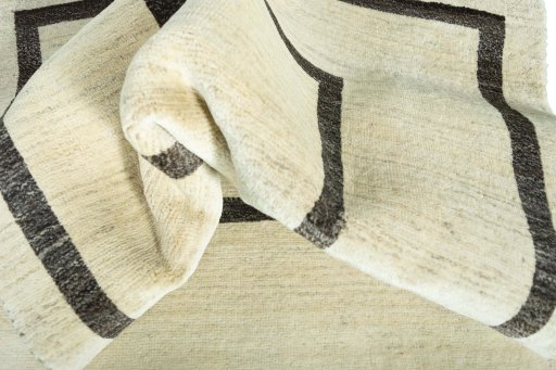Corner detail of New Persian Gabbeh rug showing border pattern and Wool pile