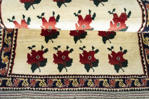 Full view of 2000s Persian Gabbeh rug from Iran / Persia, 133 × 86 cm in Beige tones