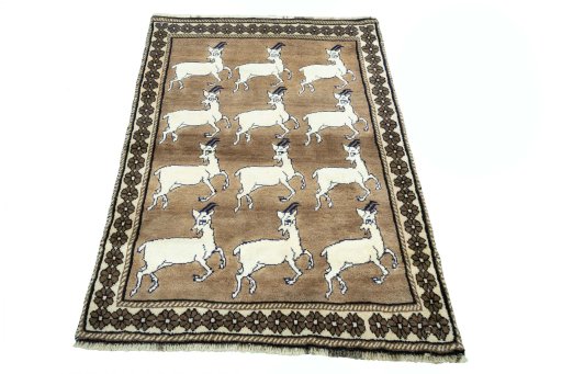 Surface texture of 2000s Persian Gabbeh rug with natural Wool and intricate pattern