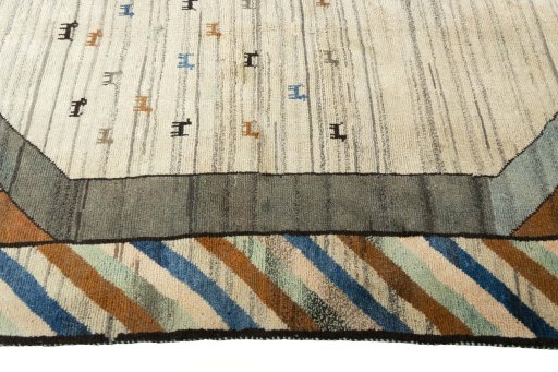 Full view of 2000s Persian Gabbeh rug from Iran / Persia, 245 × 153 cm in Beige tones