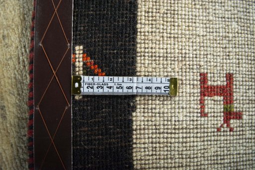 Close-up detail of 2000s Persian Gabbeh rug from Iran / Persia showing Wool weave