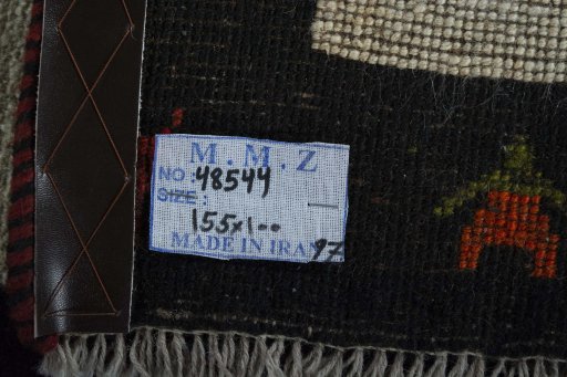 Surface texture of 2000s Persian Gabbeh rug with natural Wool and intricate pattern