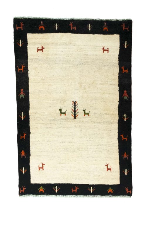 Full view of 2000s Persian Gabbeh rug from Iran / Persia, 155 × 100 cm in Beige tones
