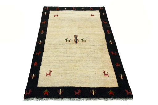 Surface texture of 2000s Persian Gabbeh rug with natural Wool and intricate pattern