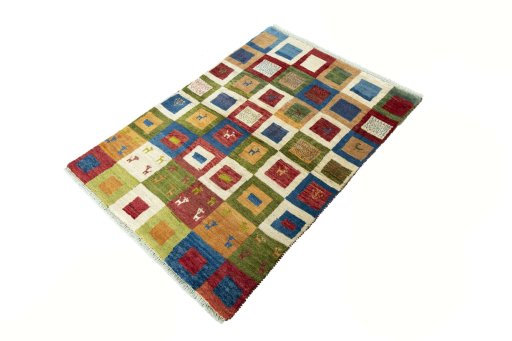 Corner detail of 2000s Persian Gabbeh rug showing border pattern and Wool pile