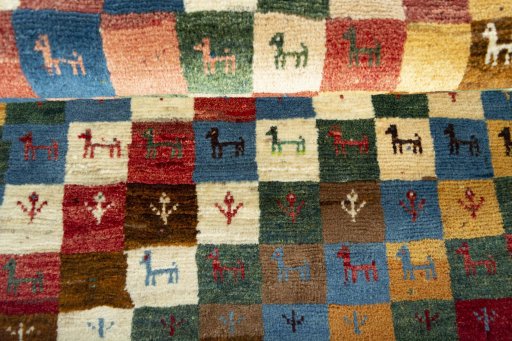 Full view of 2000s Persian Gabbeh rug from Iran / Persia, 120 × 82 cm in Multi Color tones
