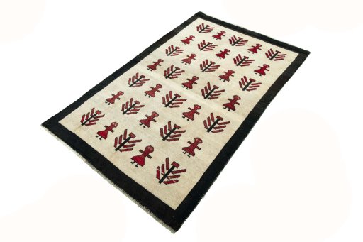 Corner detail of 2000s Persian Gabbeh rug showing border pattern and Wool pile