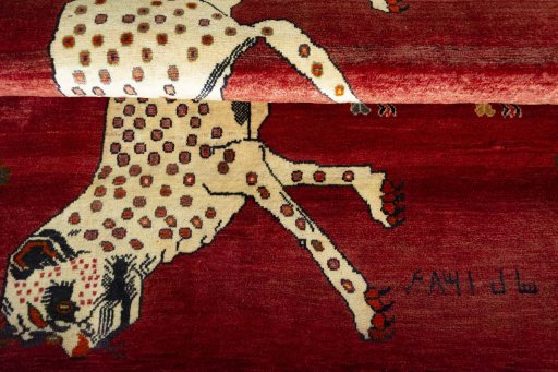 Full view of 2000s Persian Gabbeh rug from Iran / Persia, 193 × 142 cm in Red tones