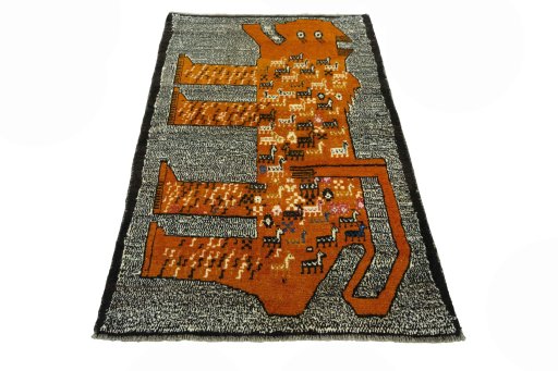 Surface texture of 2000s Persian Gabbeh rug with natural Wool and intricate pattern