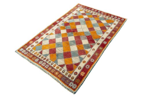 Corner detail of 2000s Persian Gabbeh rug showing border pattern and Wool pile