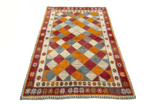 Surface texture of 2000s Persian Gabbeh rug with natural Wool and intricate pattern