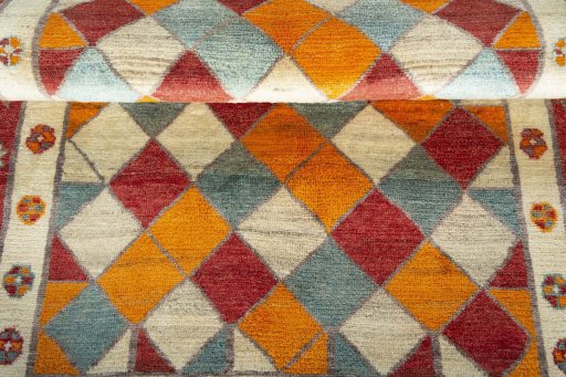 Full view of 2000s Persian Gabbeh rug from Iran / Persia, 185 × 120 cm in Multi Color tones