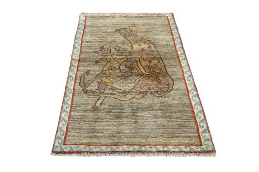 Surface texture of 2000s Persian Gabbeh rug with natural Wool and intricate pattern