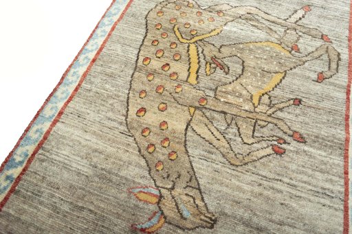 Backside of handmade 2000s Persian Gabbeh rug showing knot structure and weave density
