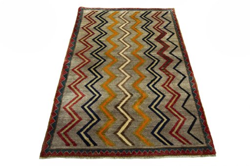 Corner detail of 2000s Persian Gabbeh rug showing border pattern and Wool pile