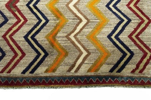 Surface texture of 2000s Persian Gabbeh rug with natural Wool and intricate pattern
