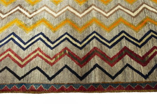 Backside of handmade 2000s Persian Gabbeh rug showing knot structure and weave density