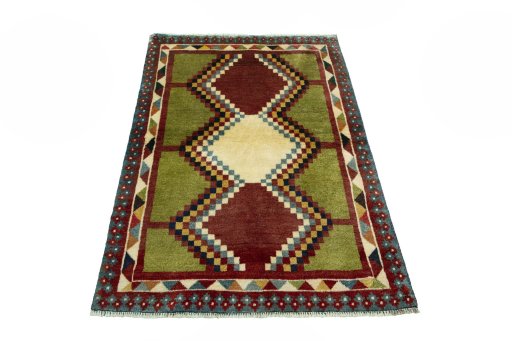 Surface texture of 2000s Persian Gabbeh rug with natural Wool and intricate pattern