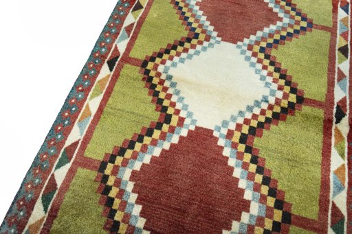 Backside of handmade 2000s Persian Gabbeh rug showing knot structure and weave density