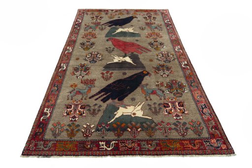 Surface texture of 2000s Persian Gabbeh rug with natural Wool and intricate pattern