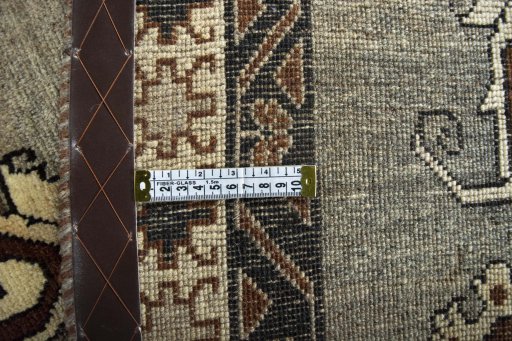 Corner detail of 2000s Persian Gabbeh rug showing border pattern and Wool pile