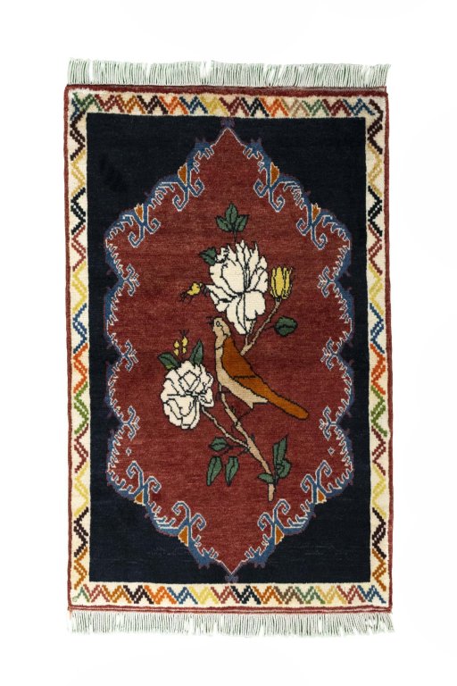 Full view of 2000s Persian Gabbeh rug from Iran / Persia, 136 × 84 cm in Red tones