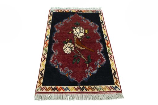 Surface texture of 2000s Persian Gabbeh rug with natural Wool and intricate pattern