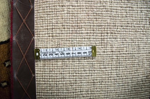 Corner detail of 2000s Persian Gabbeh rug showing border pattern and Wool pile