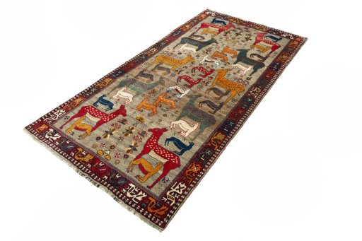 Corner detail of 2000s Persian Gabbeh rug showing border pattern and Wool pile