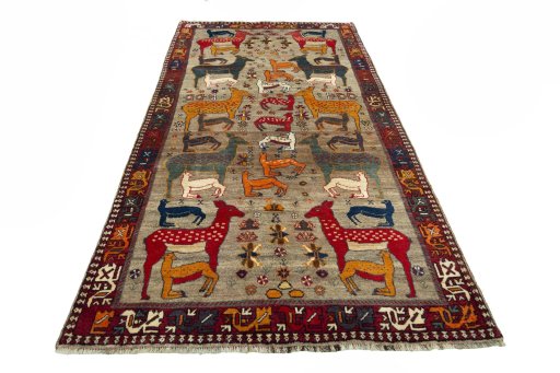 Surface texture of 2000s Persian Gabbeh rug with natural Wool and intricate pattern