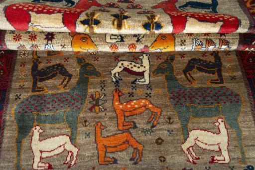 Full view of 2000s Persian Gabbeh rug from Iran / Persia, 284 × 142 cm in Multi Color tones