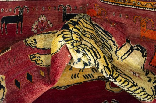 Corner detail of 2000s Persian Gabbeh rug showing border pattern and Wool pile