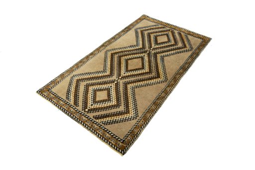 Corner detail of 2000s Persian Gabbeh rug showing border pattern and Wool pile