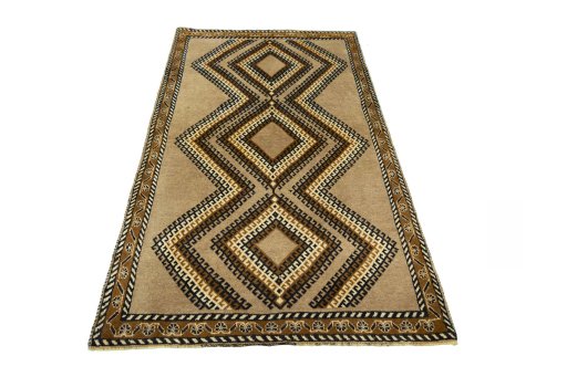 Surface texture of 2000s Persian Gabbeh rug with natural Wool and intricate pattern