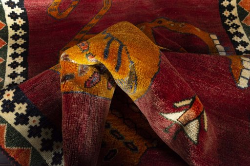 Corner detail of 2000s Persian Gabbeh rug showing border pattern and Wool pile