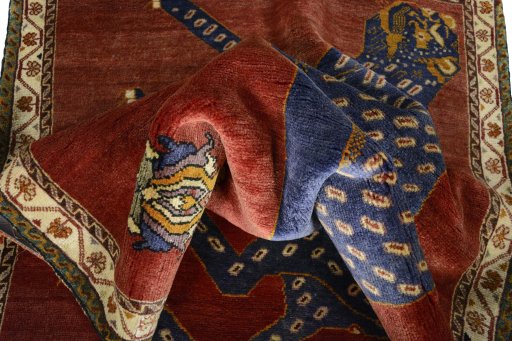 Corner detail of 2000s Persian Gabbeh rug showing border pattern and Wool pile