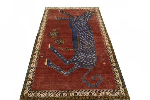 Surface texture of 2000s Persian Gabbeh rug with natural Wool and intricate pattern
