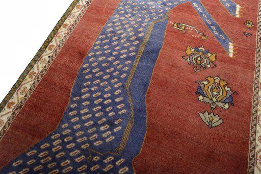 Backside of handmade 2000s Persian Gabbeh rug showing knot structure and weave density
