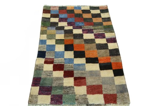 Surface texture of 2000s Persian Gabbeh rug with natural Wool and intricate pattern