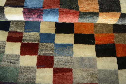 Full view of 2000s Persian Gabbeh rug from Iran / Persia, 116 × 78 cm in Multi Color tones