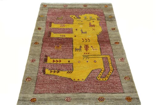 Surface texture of 2000s Persian Gabbeh rug with natural Wool and intricate pattern