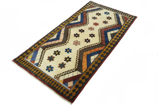 Corner detail of 2000s Persian Gabbeh rug showing border pattern and Wool pile