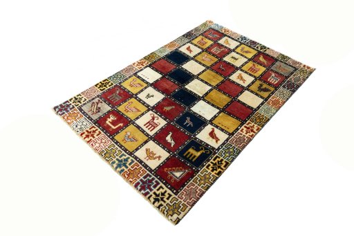 Corner detail of 2000s Persian Gabbeh rug showing border pattern and Wool pile