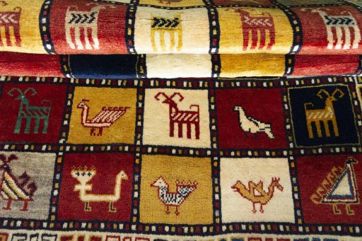 Full view of 2000s Persian Gabbeh rug from Iran / Persia, 173 × 115 cm in Multi Color tones
