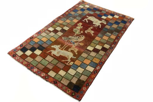 Corner detail of 2000s Persian Gabbeh rug showing border pattern and Wool pile
