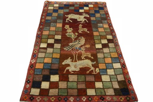 Surface texture of 2000s Persian Gabbeh rug with natural Wool and intricate pattern