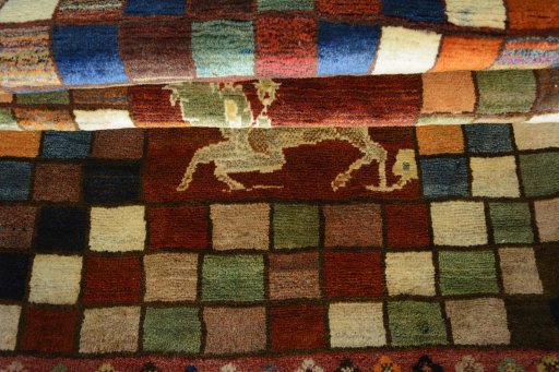 Full view of 2000s Persian Gabbeh rug from Iran / Persia, 177 × 111 cm in Multi Color tones