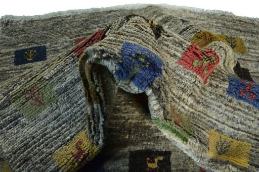 Corner detail of New Persian Gabbeh rug showing border pattern and Wool pile